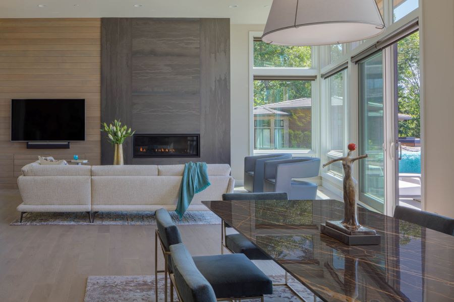 Modern dining and living room with soft neutrals displaying luxury home design